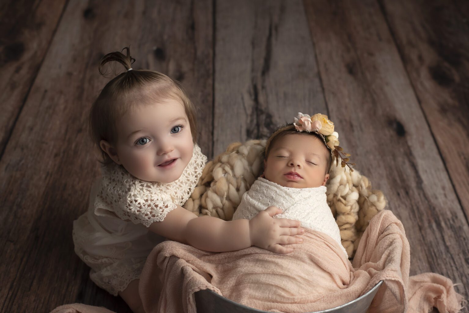 Two year old sister with newborn sister